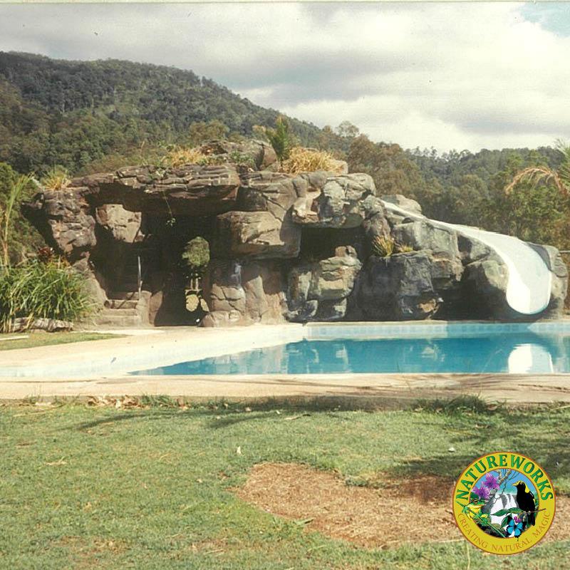 Artificial rock cave with slide - custom designed, manufactured and installed by Natureworks to enhance the community area of the golf course.