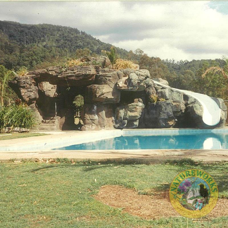 Natureworks Australia Artificial rock cave with slide - custom designed, manufactured and installed by Natureworks to enhance the community area of the golf course.