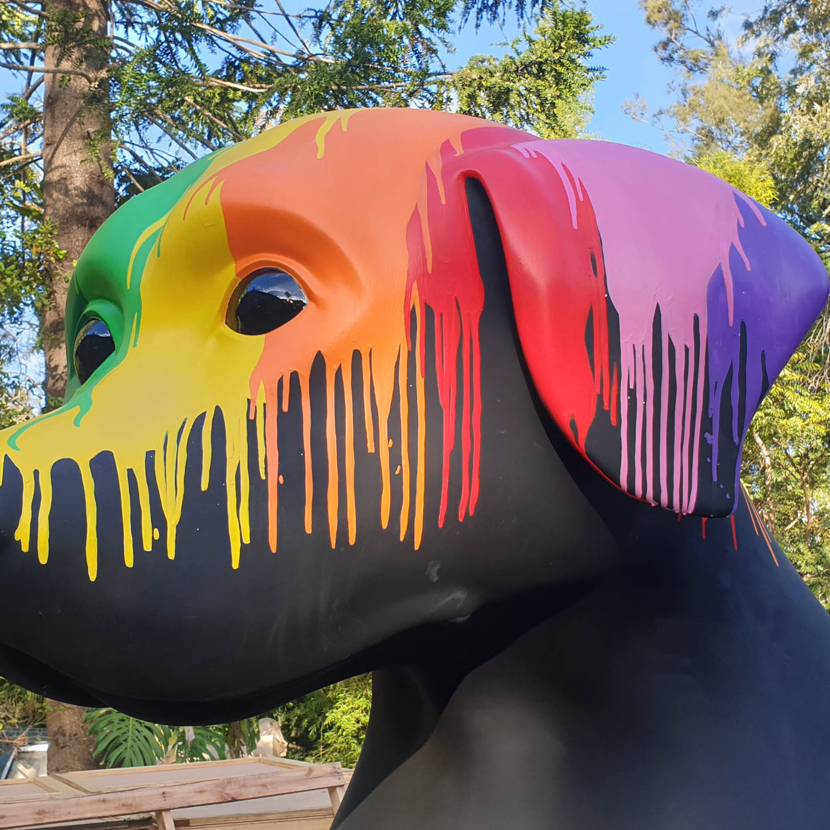 Natureworks Australia Giant Black Dog with Paint drips- 9ft tall sitting- close up of head and paint drips