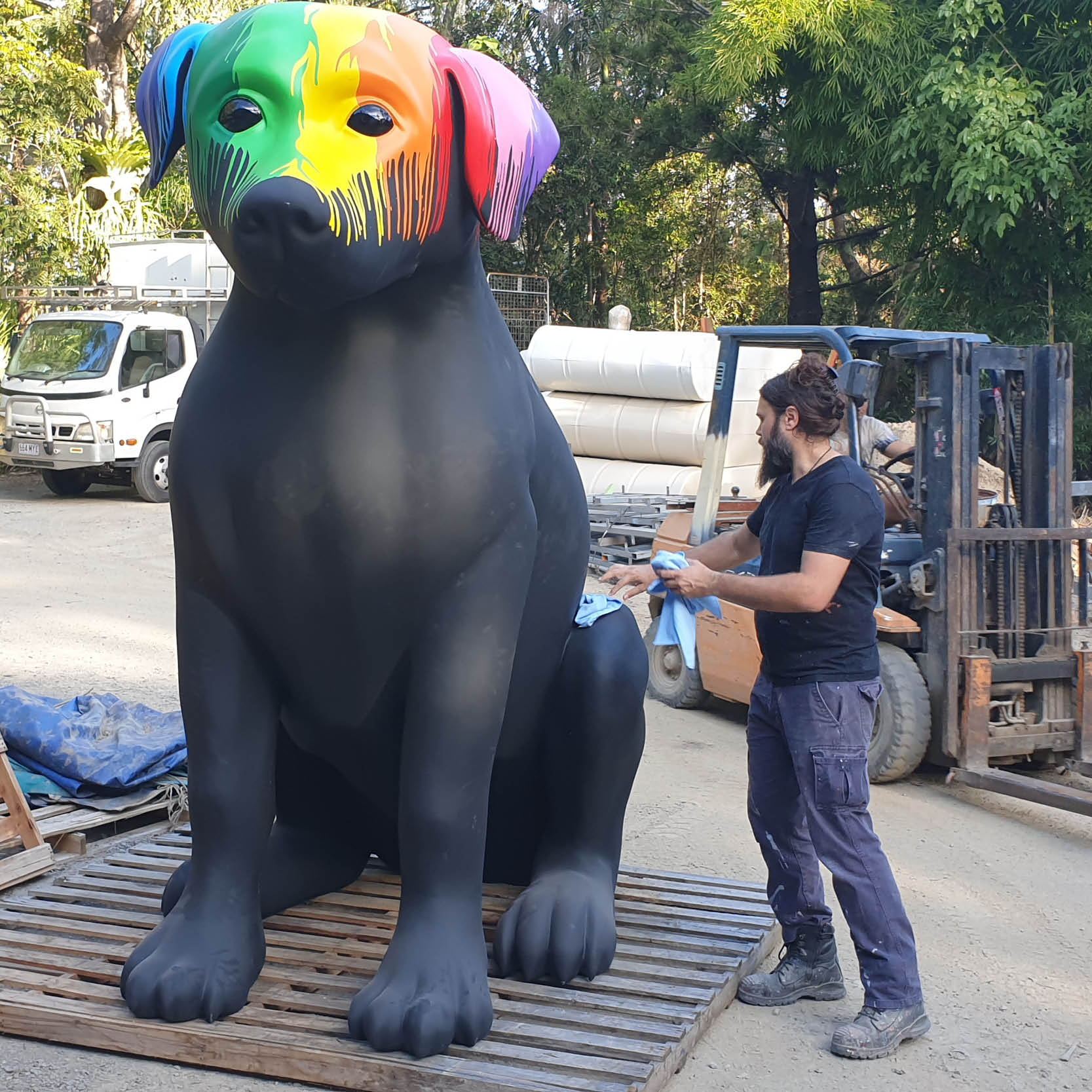 Natureworks Australia Giant Black Dog with Paint drips- 9ft tall sitting - BlackLab2.7m - with staff cleaning dog