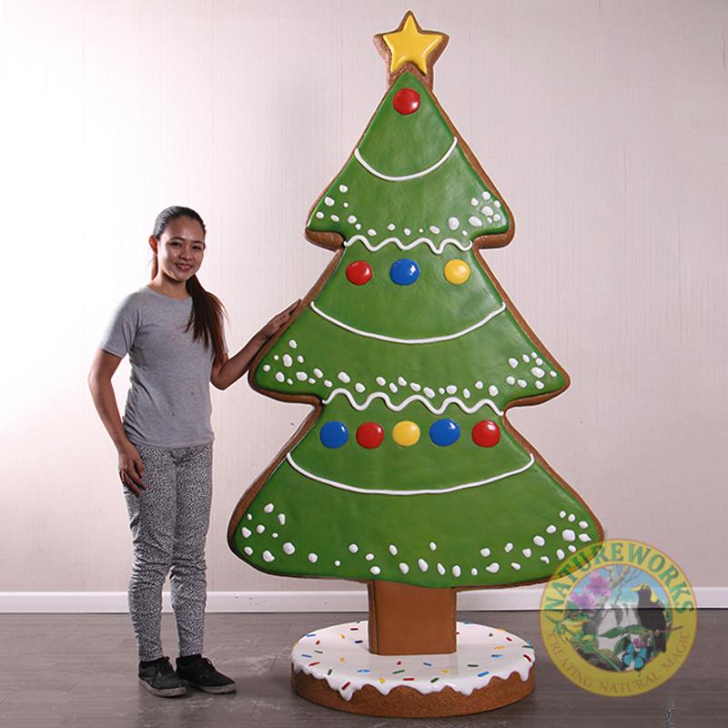 Natureworks Australia Gingerbread Cookie Christmas tree prop on base plate - 2.1m tall - 240217- shown with girl