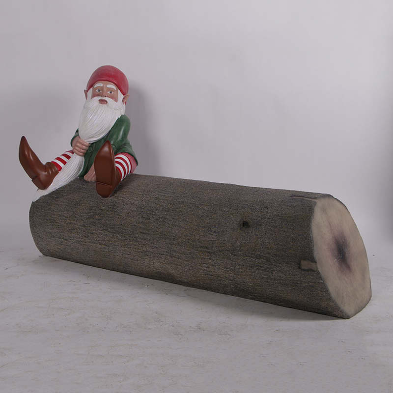 Natureworks Australia Christmas Gnome on tree trunk bench-190096- Angle view showing gnome and tree trunk