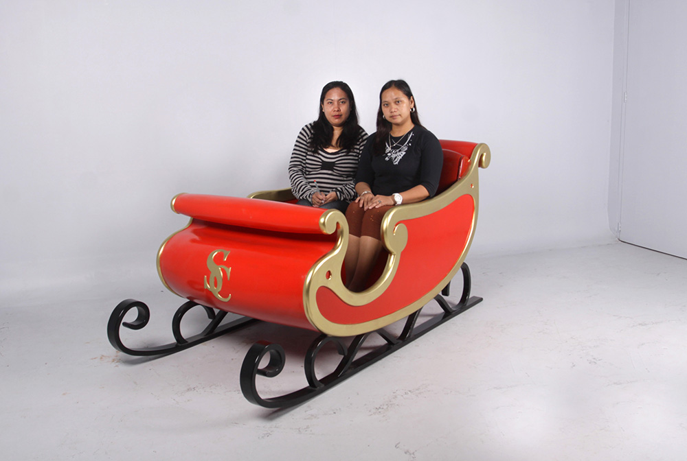 Natureworks Australia Christmas Santa Sleigh - 160264red- shown with ladies sitting inside