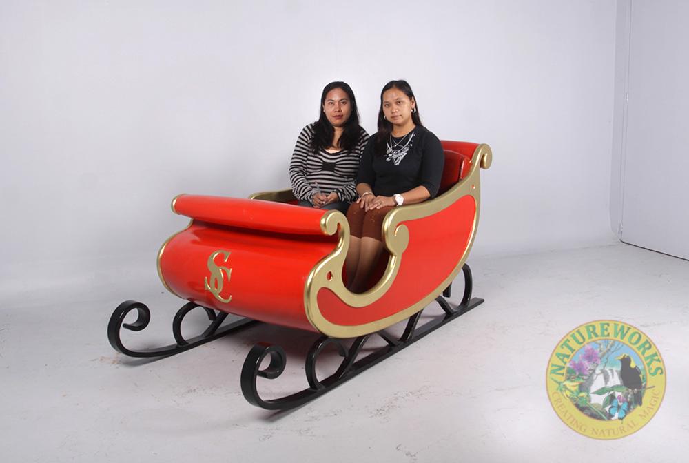 Natureworks Australia Christmas Santa Sleigh - 160264red- shown with ladies sitting inside