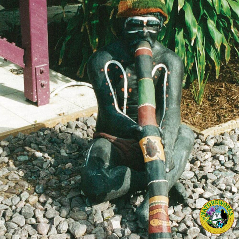 Aboriginal life-size sculpture - Elder man playing Didgeridoo