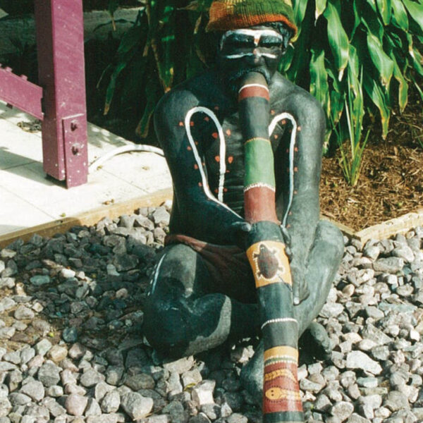 Aboriginal life-size sculpture - Elder man playing Didgeridoo