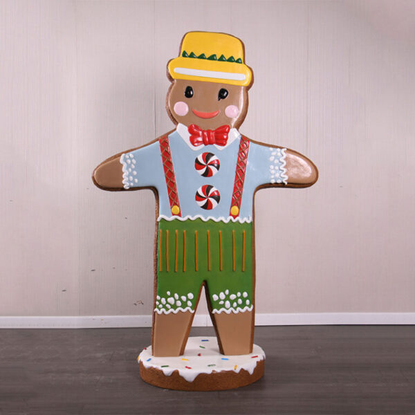 Gingerbread Man Statue with yellow hat and red bow tie on iced base