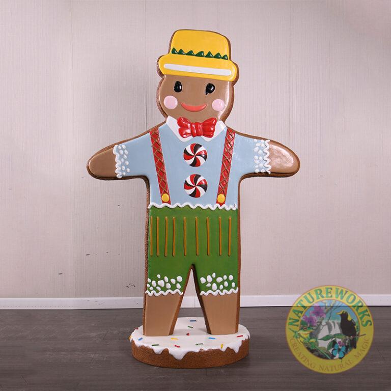 Gingerbread Man Statue with yellow hat and red bow tie on iced base