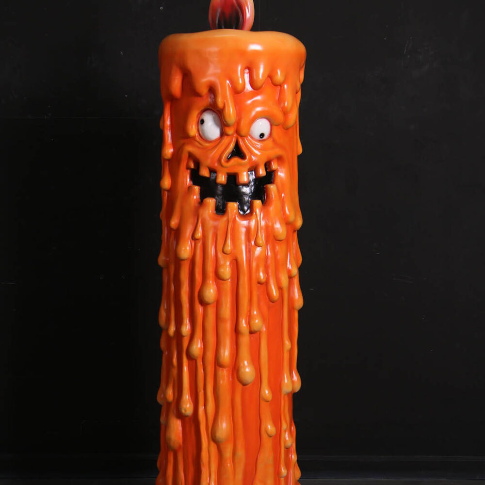 Scary Pumpkin Candle sculpture with melting wax and flaming tip