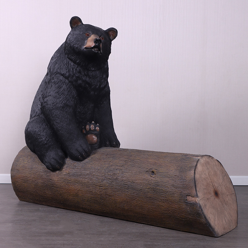 Natureworks Australia Bear sitting on tree trunk - bench seat -angle view