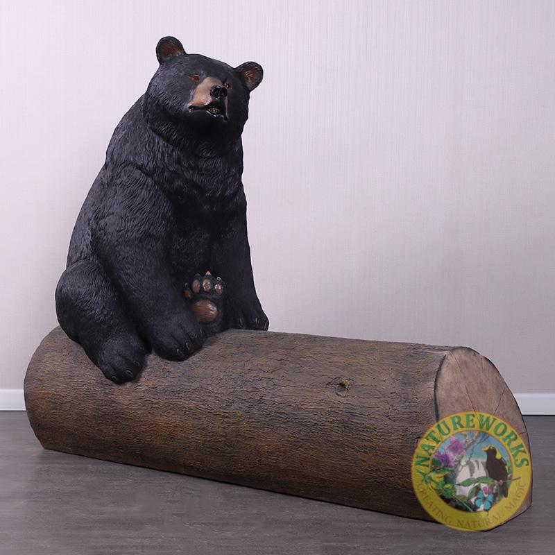 Natureworks Australia Bear sitting on tree trunk - bench seat -angle view