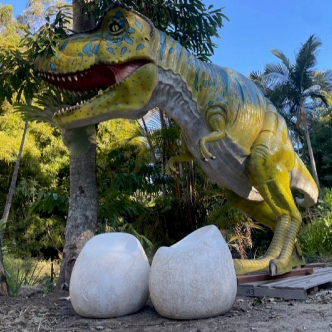 Natureworks Australia Dinosaur egg seat- NW-dinoESeat- - shown outside with giant T-Rex dinosaur
