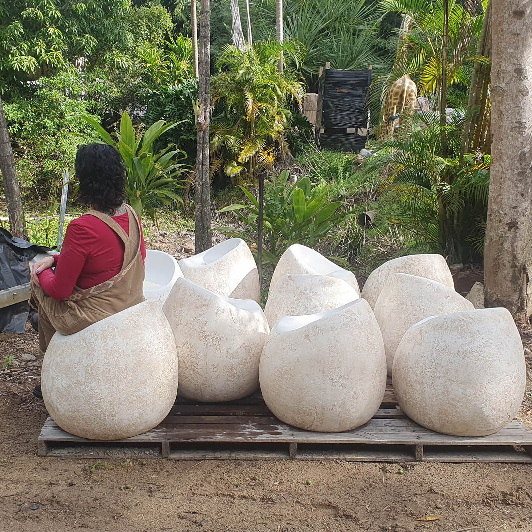 Natureworks Australia Dinosaur egg seat- NW-dinoESeat- shown with lady sitting in seat