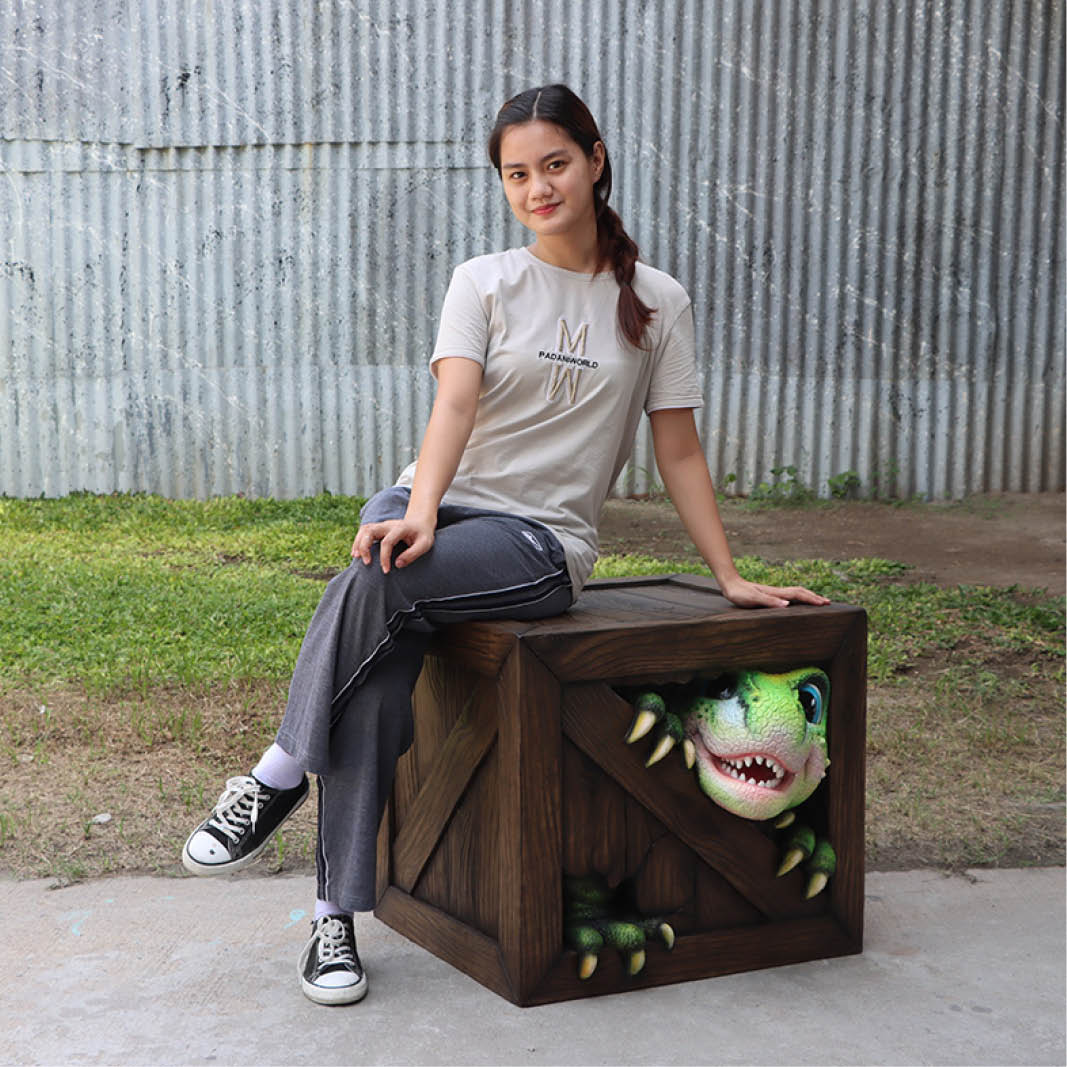 Natureworks Australia Dinosaur Peek-a-Boo table-234136- shown with lady sitting on table