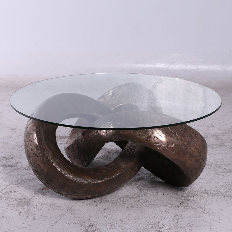 trifoil table base sculpture with round tabletop